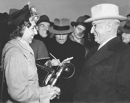 Press photographer Marion Carpenter with President Truman.
