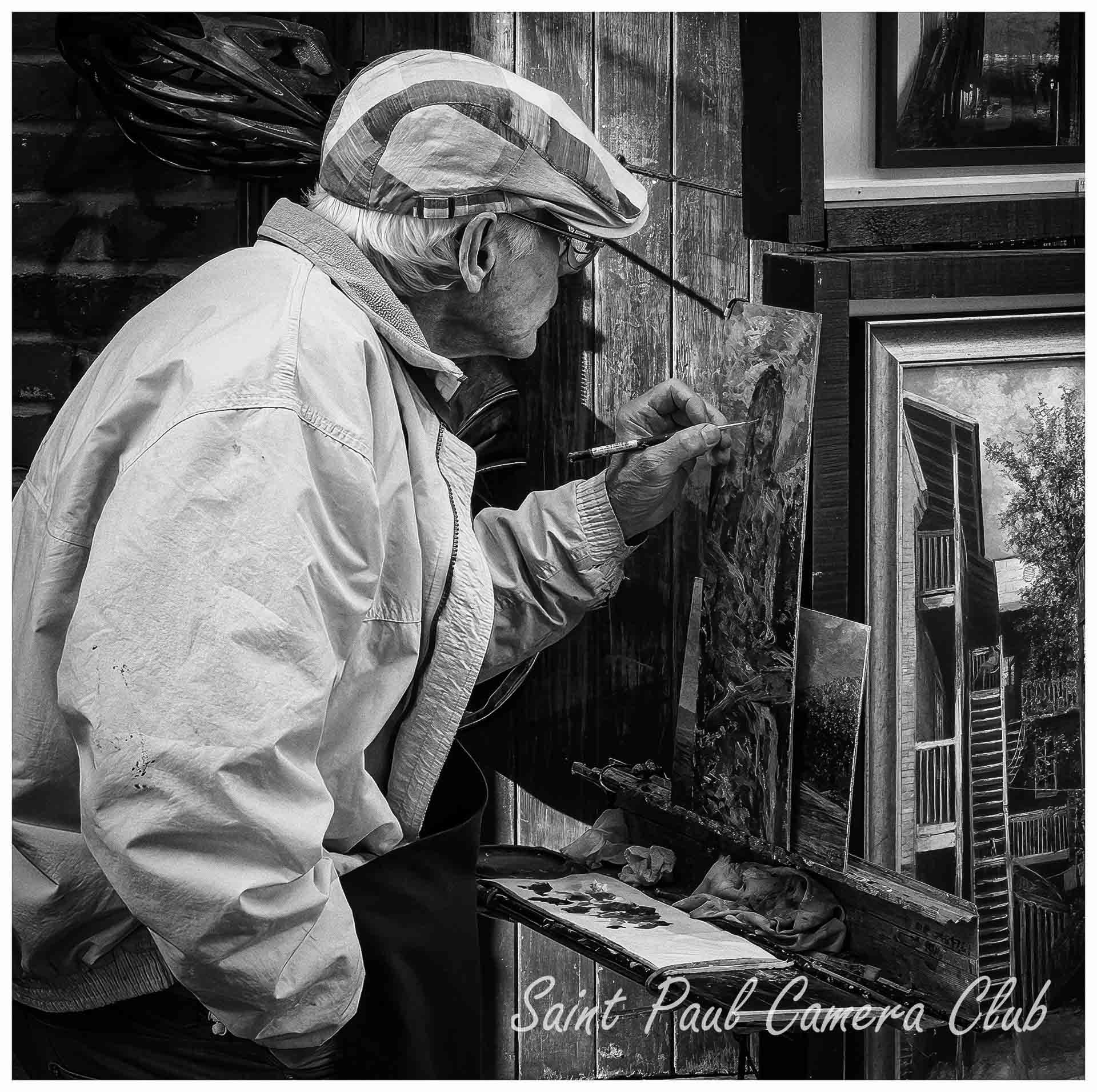 Quebec City Street Artist by Paul Rogne (March Monochrome Print Salon)